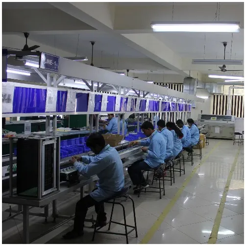 Operators at an electronics assembly line