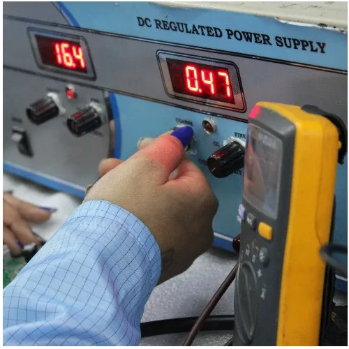 Regulated DC supply and multimeter on a test bench